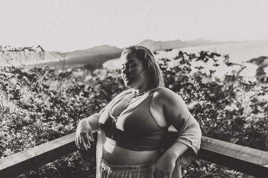 a woman sitting on a ledge