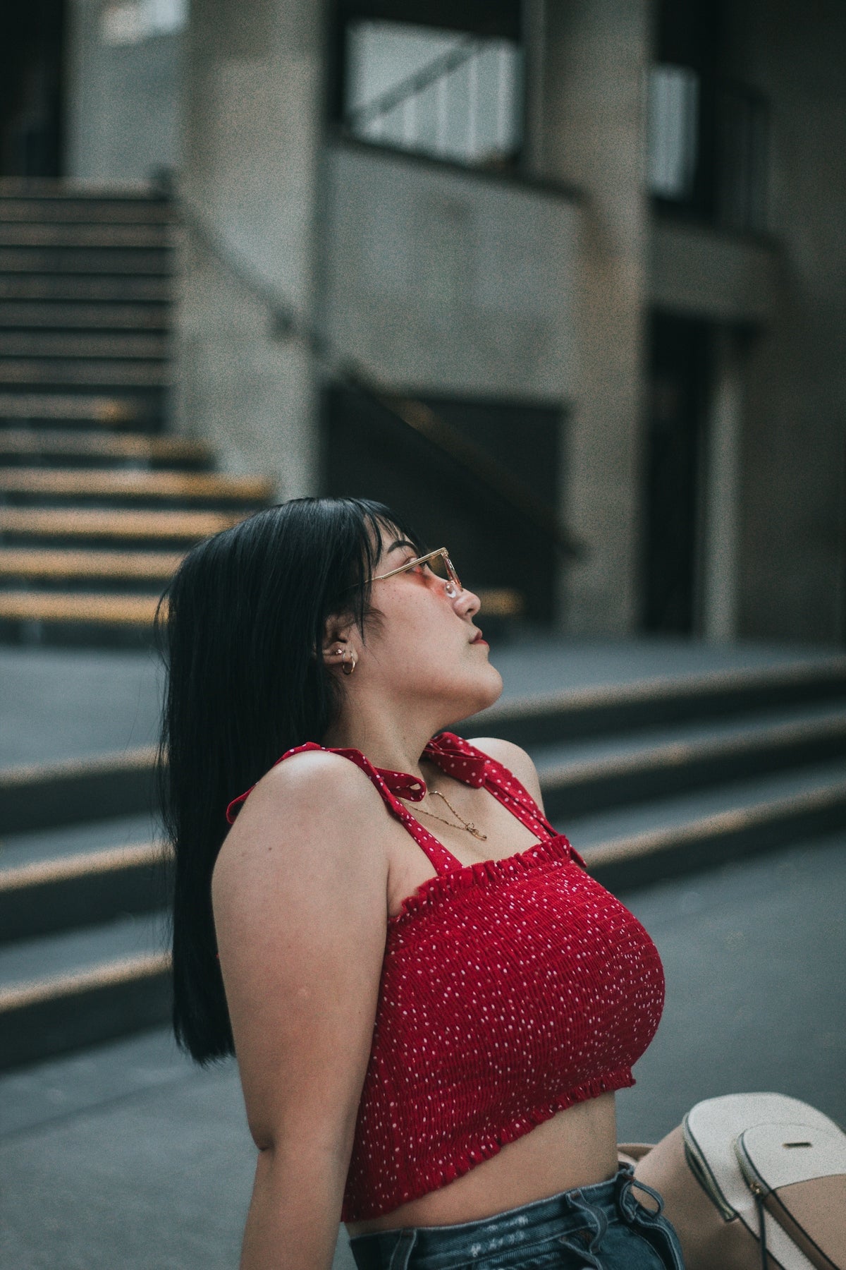a woman sitting on a bench