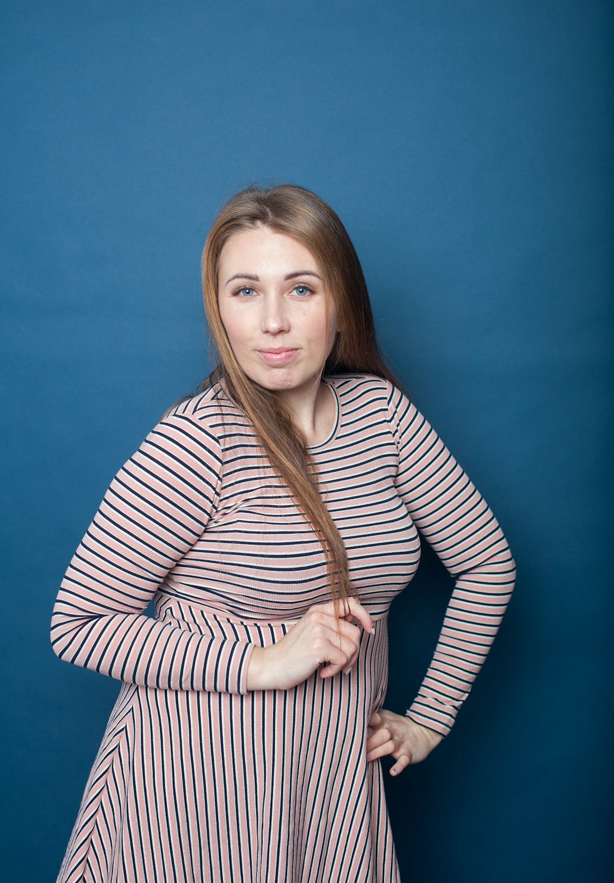 a woman in a striped dress