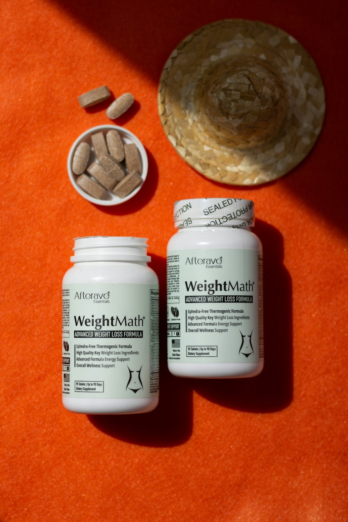 A couple of bottles of pills sitting on top of a table